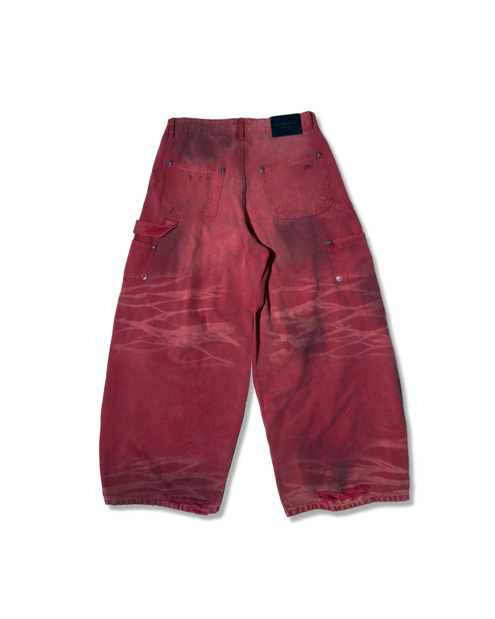 Red distressed pants on a white background